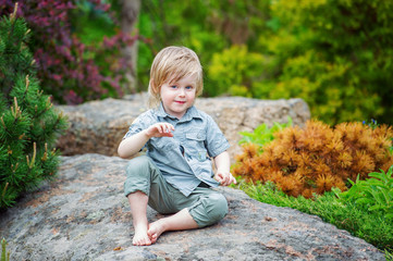 Portrait of a pisitive kid in the beautiful garden