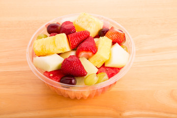 Cut Fresh Fruit in Plastic Bowl