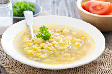 Soup with salted cucumbers and pearl barley