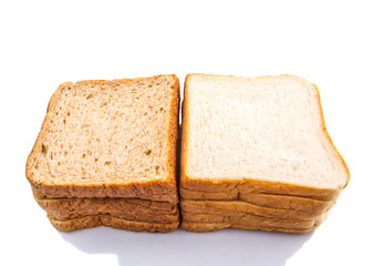 Whole Wheat Bread and Sandwich Bread Over White Background