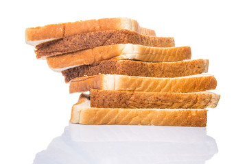Whole Wheat Bread and Sandwich Bread Over White Background