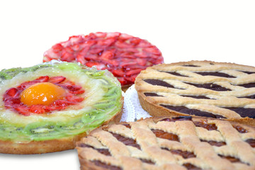 Composition of strawberry pie and chocolate tarts