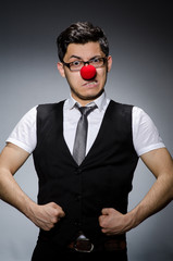 Funny businessman with clown nose