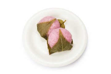 rice cake with bean paste wrapped in a preserved cherry leaf