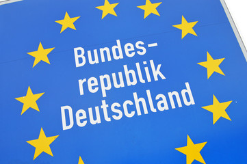 Close-up of a sign at the border of Germany