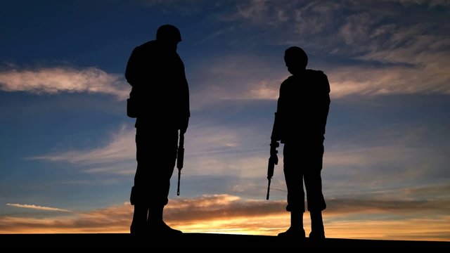 Soldiers Silhouette at the Sunset