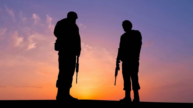 Soldiers Silhouette at the Sunset
