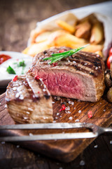 Beef steak on wooden table