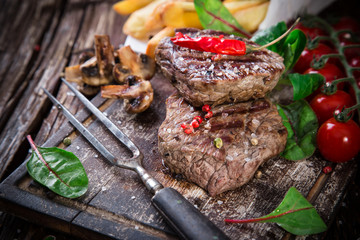 Beef steak on wooden table