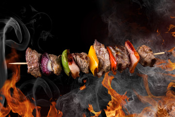 Tasty skewers with fire flames.