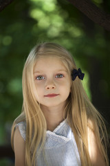 Naklejka premium Portrait of a beautiful blonde little girl three years