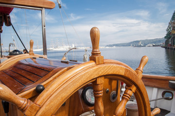 Old boat steering wheel from wood © dechevm