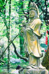 Sculptures of Chinese gods. (Kuan Yin) in the park.