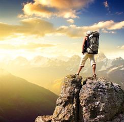 Tourist on rock. Sport and active life concept