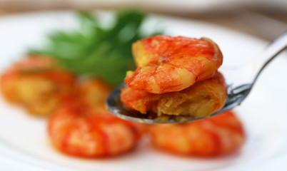 Cooked shrimp on a spoon