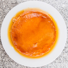 Caramel pudding on a white plate