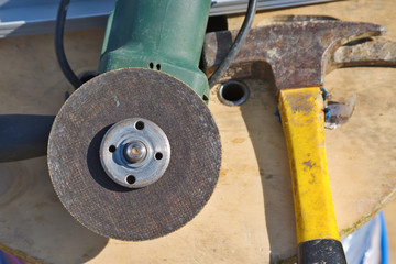 Construction tools. Hammer and electric grinder