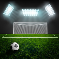 Soccer ball on green stadium arena