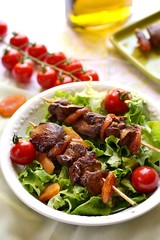 Yakitori with chicken liver, dried apricots, tomatoes
