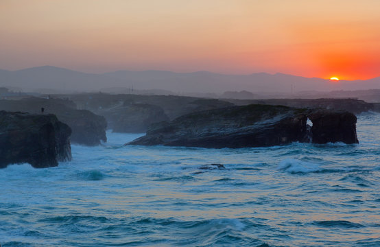 Beautiful sunset on Playa de las Catedrales , Spain