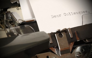 Fototapeta na wymiar Text Dear Colleagues typed on old typewriter