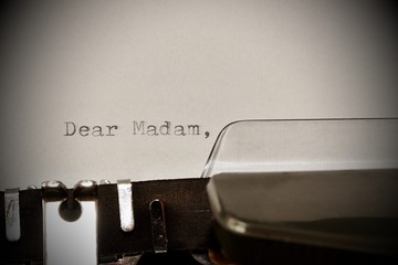 Text Dear madam typed on old typewriter