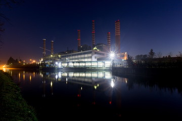 Fototapeta premium Electricity power plant near a river