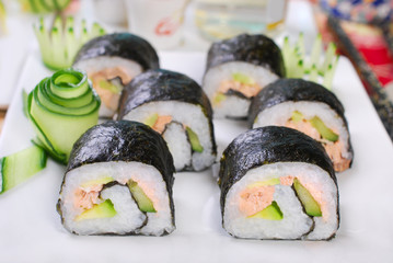 maki sushi rolls with salmon and avocado