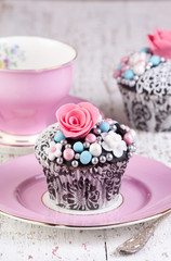 pink tea cup and cupcakes