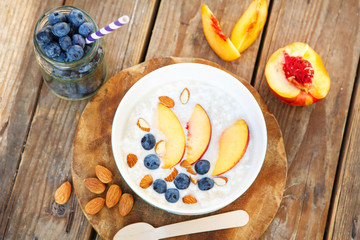 Granola with fresh organic blueberries, nectarines and almonds