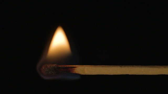 Wooden match burning horizontal, fire spreads left right sound