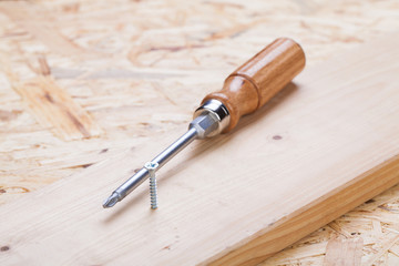 Phillips head screwdriver and wood screws
