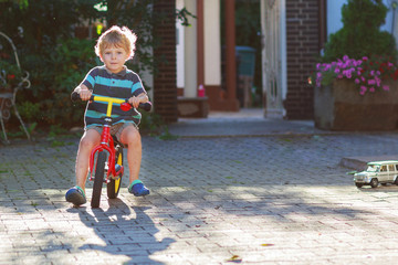 Little toddler boy of 3 years having fun on his  bicycle