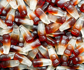 Naklejka premium Chewy cola bottle background