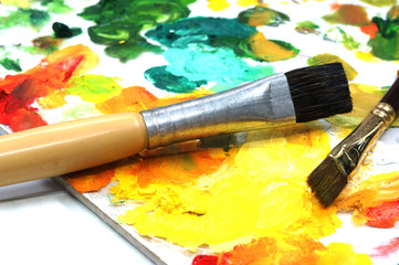 oil paints and paint brushes on a palette