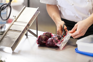 Chef slicing boiled beetroot