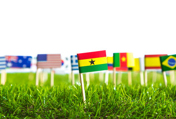 Paper cut of flags on grass for Soccer championship 2014
