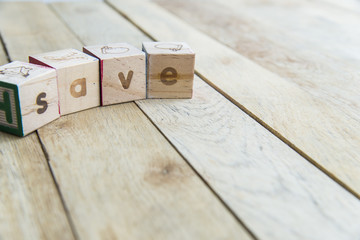 Wooden blocks are Save word on wooden floor