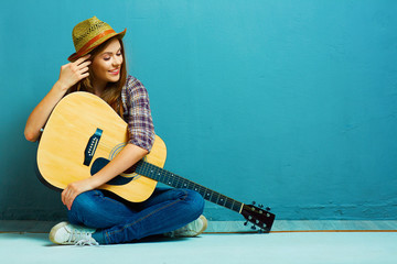 Teenager girl guitar play.