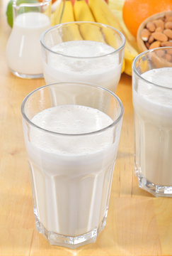 Banana and almond milk smoothie on a table.