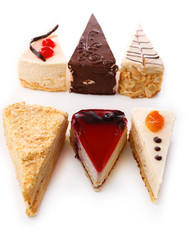 Assortment of pieces of cake, isolated on white © Africa Studio