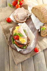 Delicious sandwiches with meet on table close-up