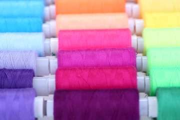 Multicolor sewing threads background