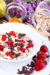 Healthy cereal with fruits on wooden table