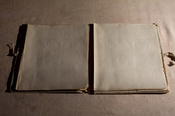 Open Book blank on the background of old cloth