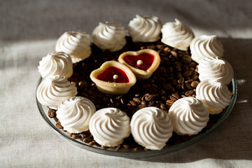 French vanilla meringue cookies and two sweet hearts