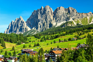 Green meadows and high mountains above Cortina D ampezzo,Italy - obrazy, fototapety, plakaty