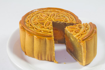 Sliced mooncake on white plate