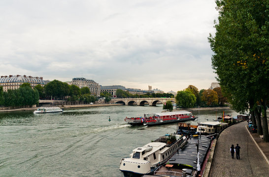 river seine in paris on a cloudy day