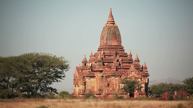 Tourists climb to the observation deck of Ananda Temple.